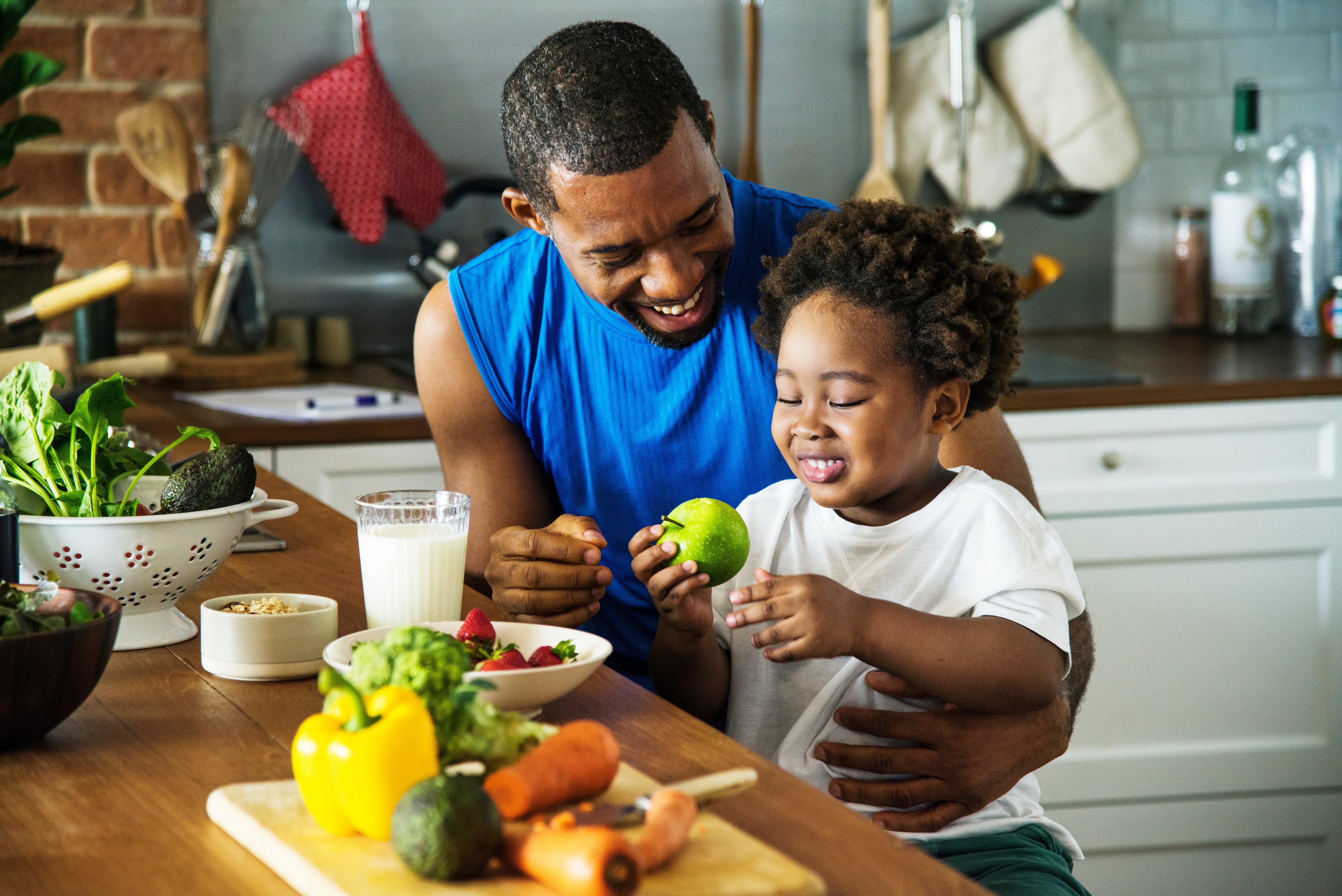 A man and son eating healthy food