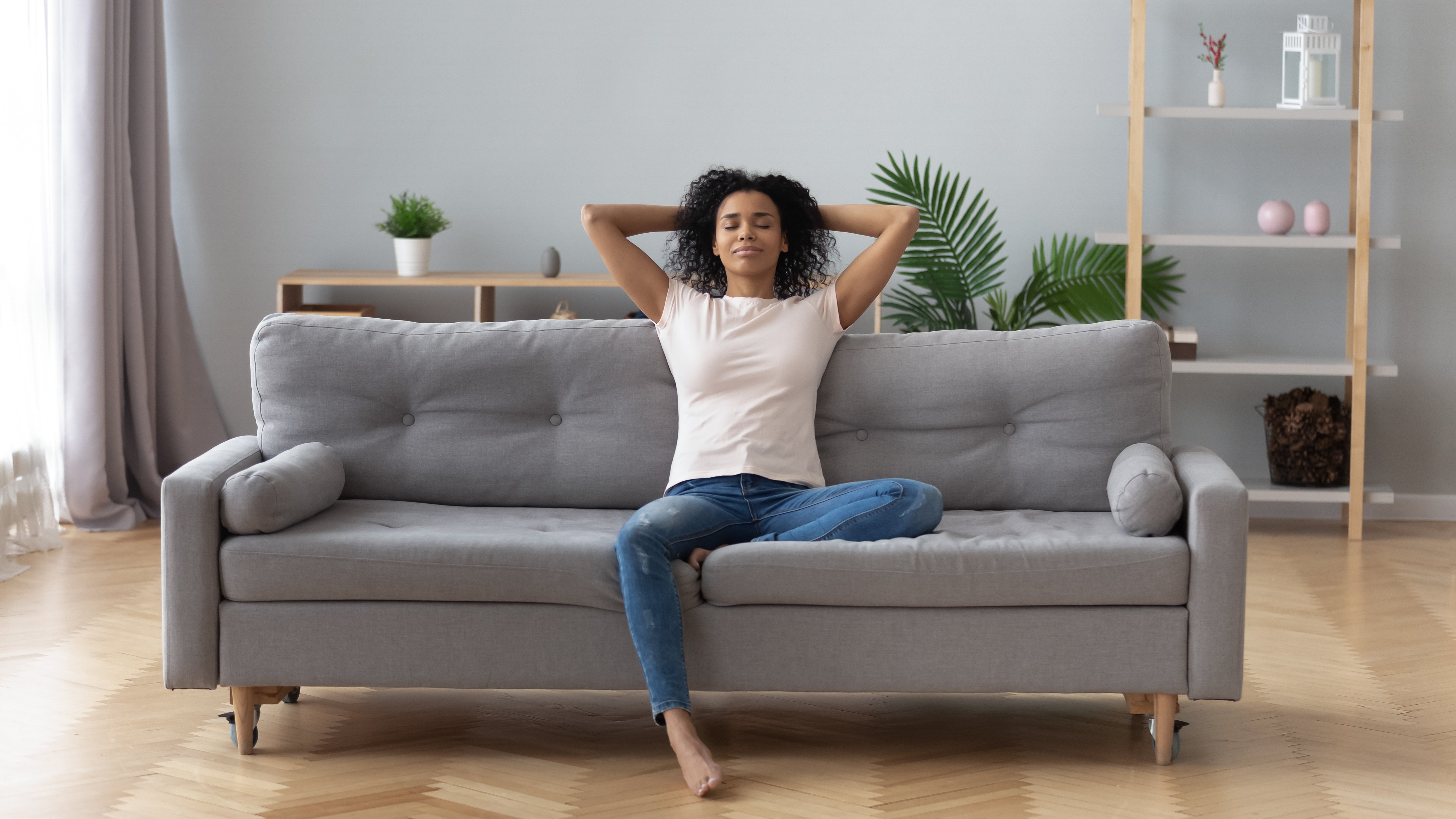 A woman relaxing on a couch 
